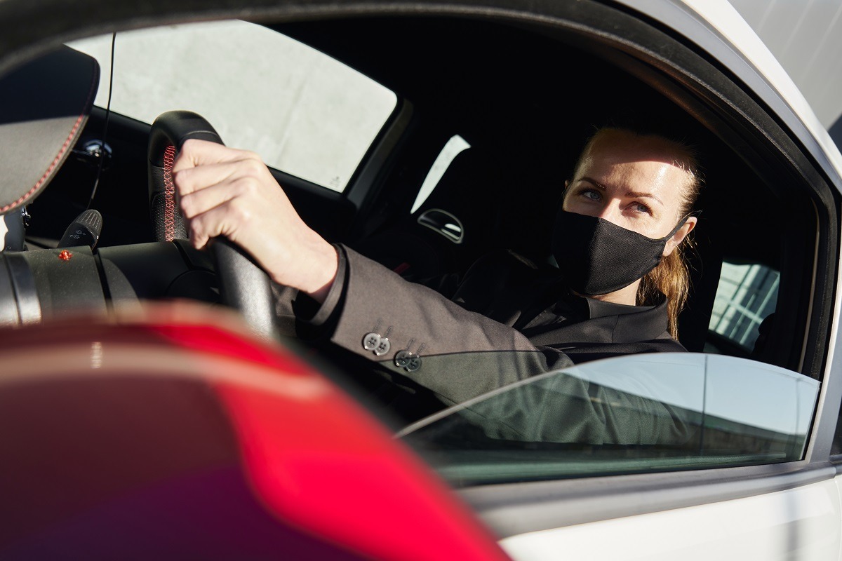 young girl in a black protective mask